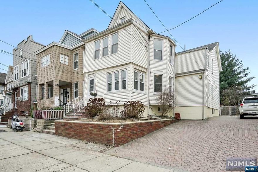 What a great opportunity to occupy and/or invest in this income producing property. A freshly updated 2 family home that's located in one of Bayonne's most desirable areas. It's within a pedestrian range of the beautiful waterfront park known as Stephen R. Gregg County Park and just a short drive away to major highways and NYC. Schools, restaurants, shopping, and more are only minutes away. Across the threshold, nice touches include new vinyl flooring, freshly painted walls, and recessed lighting throughout. Each unit features a fully renovated kitchen with new cabinets and appliances including a walk-in pantry on the first floor. The full basement is finished to include a family room, bathroom with shower, laundry area, and a spare room for your creative use. The finished attic includes 2 additional rooms that can be used as office space or storage. With roughly 3500 square feet of living area, this multi-family home has plenty of space to fit all your needs.