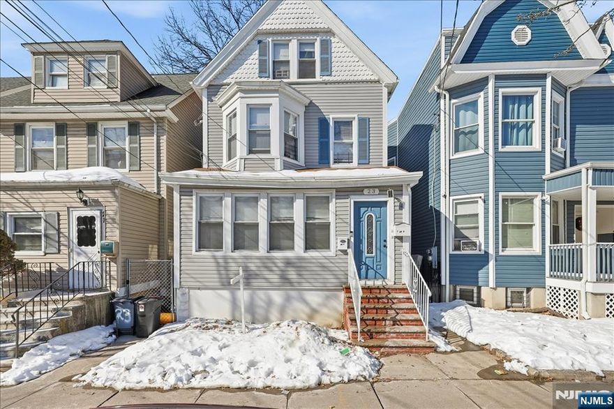 Welcome home! 23 Cummings Street is a well-located two-family property in Irvington, offering a practical opportunity for an owner-occupant or investor. Conveniently situated near public transportation and major highways, the home provides easy access for commuters while remaining part of an established residential neighborhood. The first unit features one bedroom and one bathroom, an eat-in kitchen that has been recently renovated, and a finished basement that adds an additional bathroom along with flexible recreational space. The second unit spans two floors. It includes a light filled primary bedroom with a walk-in closet, and two additional bedrooms upstairs. The property also includes a back deck and a large backyard, great for hosting or relaxing. This home is great for a buyer looking to live in one unit while generating rental income to help offset monthly expenses. Schedule your tour today! Unit 2 images are from before the tenants moved in. Buyer to verify taxes with the municipality.