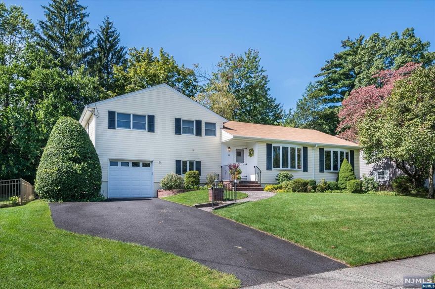 Welcome to this spacious,expanded & lovingly maintained home,situated on a quiet street in one of Glen Rock's most sought-after neighborhoods.Boasting 2200 SF + a finished basement,this 3 BR,2 1/2 bth home offers an open floor plan w/kitchen overlooking a wonderful FR addition w/gas fpl & SGD to deck,lush backyard,koi pond & patio.Sunlit LR & DR are framed on either end by large bay windows. Another addition to the home is an enormous home office/BR w/lots of built-in cabinetry & a full bth-making it a wonderful guest suite!Just a few steps away from the kitchen is another den,laundry rm,access to the backyard,as well as inside entrance to the extra depth garage.Upstairs are 3 large BRs, incl a primary suite w/half bth & WIC,& a large hall bth.On the lower level there is a semi-finished rec rm w/beautiful decorative stone fpl.HW floors are under most carpeting. A great opportunity to move into a terrific neighborhood close to Glen Rock's top-rated schools & excellent NYC trans.