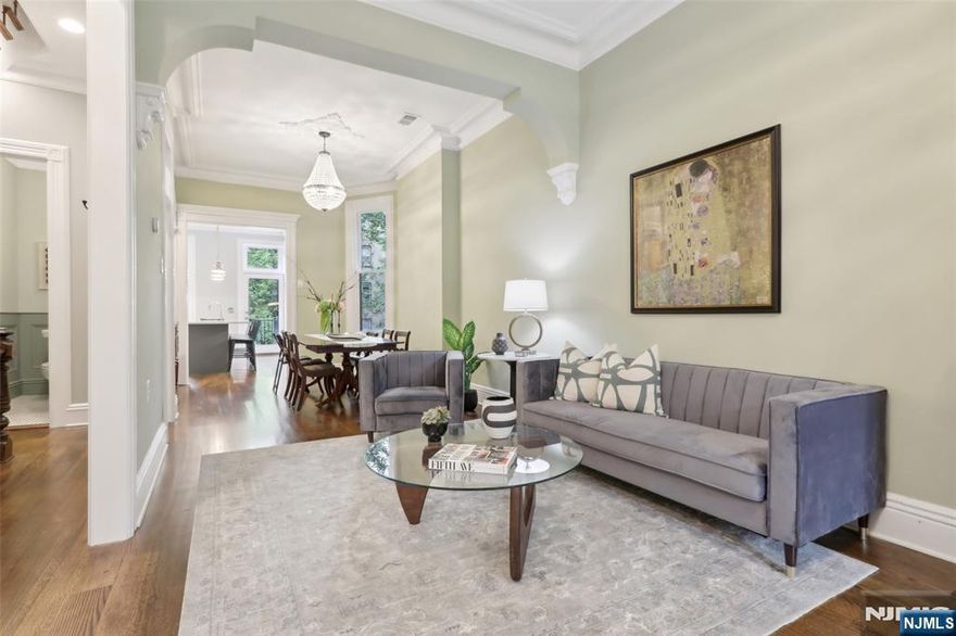 Welcome to 254 4th Street, a stately 6-bedroom, 4.5-bath historic residence spanning 3,400 square feet in the heart of Downtown Jersey City. Built in 1886 by architect Edward Simon, this Italianate-style 2-family home features an elaborate wood cornice, brick lintels, and terra cotta insets. Commissioned by Benjamin Murphy, a Civil War veteran and Jersey Cityâ€™s Chief of Police from 1879 to 1906, this home is rich in local heritage. Set on a picturesque tree-lined street, it blends 1880s charm with modern design. The parlor level offers three living spaces, bay windows, a gas fireplace, and a chefâ€™s kitchen with quartz island, premium KitchenAid appliances, and direct access to a serene deck and garden. The third floor features three sun-filled bedrooms and a designer full bath with Grohe fixtures. The top floor boasts a private primary suite with bay windows, walk-in closet, spa-like marble 5-piece bath, nursery or office, guest bath, washer/dryer, and wet bar. A staircase leads to a commercial-grade roof, ideal for a future deck. Updates include new plumbing, 200-amp electric, and 3-zone HVAC. The garden unit has a private entry, 1 bedroom, 1 bath, and living spaceâ€”ideal for guests, income, or Airbnb. Zoned for P.S. 37 and near parks, PATH, shops, and top schools, this home is a rare blend of history, comfort, and location.