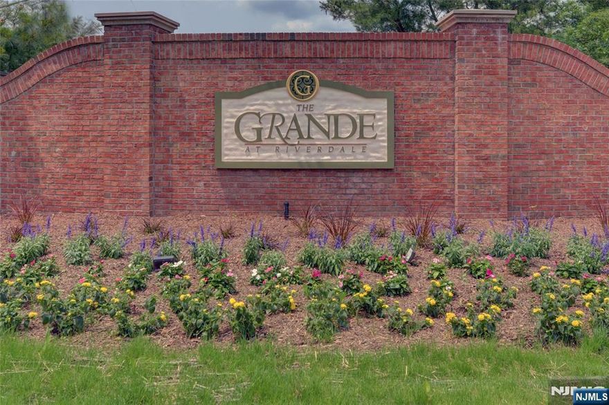 Totally updated 4 years ago, this "Hickory Model" 2nd floor end unit w terrace is ready for you to bring your bags and enjoy this comfortable style of Grande living. Featuring 2 pools, tennis court, clubhouse, excercise room, conference room, billiards/game room and basketball court too. Mountain views and surrounding community views adorn this 2 bedroom, 2 bath condo with spacious Loft which has a closet and can be a 3rd bedroom, den, family room, or whatever your heart desires. 1553 S.F of a relaxed, private and quiet location. Featuring a Kitchen with center island, and marble countertops, Open floor Dining Room, Living Room and Kitchen which leads out to terrace. Spacious LR w/gas FP and lots of windows allows lots of sunlight. Laundry area accommodates full size W/D side by side! One car garage assigned parking space underneath building and additional parking outside of unit. Near major highways, shopping and restaurants, etc. You may have no more than 2 pets with under 35lb weight limit per each pet. Take advantage of Riverdale's low taxes.