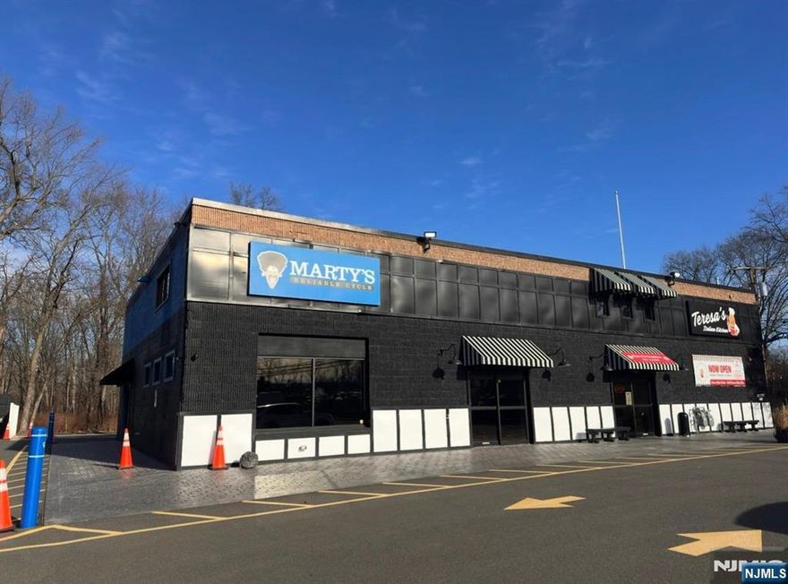 Large Store Front. Left Side. Exceptionally clean and versatile multi-level commercial space. Offers flexible leasing options in a well-maintained mixed-use building. Space may be leased individually or combined, allowing tenants to tailor the layout to their operational needs. Formerly Marty's Bike Shop. 2,050 sq ft Lower Level. 4,000 sq ft Upper Level. Features include separate entrances, multiple bathrooms, private offices, and professionally installed systems throughout. Lower Level offers great retail space and ADA-accessible restroom. Upper level offers two offices, 2 additional bathrooms (1 with shower), and potential for ancillary use such as administrative space, meetings, or specialty functions. Layout allows areas to be fully closed off for independent use, with separate code compliance. Property has undergone thoughtful improvements. Fully hardwired with security cameras, and maintained to a high standard. Ideal for retail, service, office, or specialty users seeking flexibility, clean infrastructure, and a landlord open to collaborative leasing solutions. Long-term leases considered. Great visibility on Ridgedale Avenue. Plenty of parking, easy access to major highways. Interior Images and Floor Plan coming soon! Current tenant-occupied Restaurant on the Right Side.