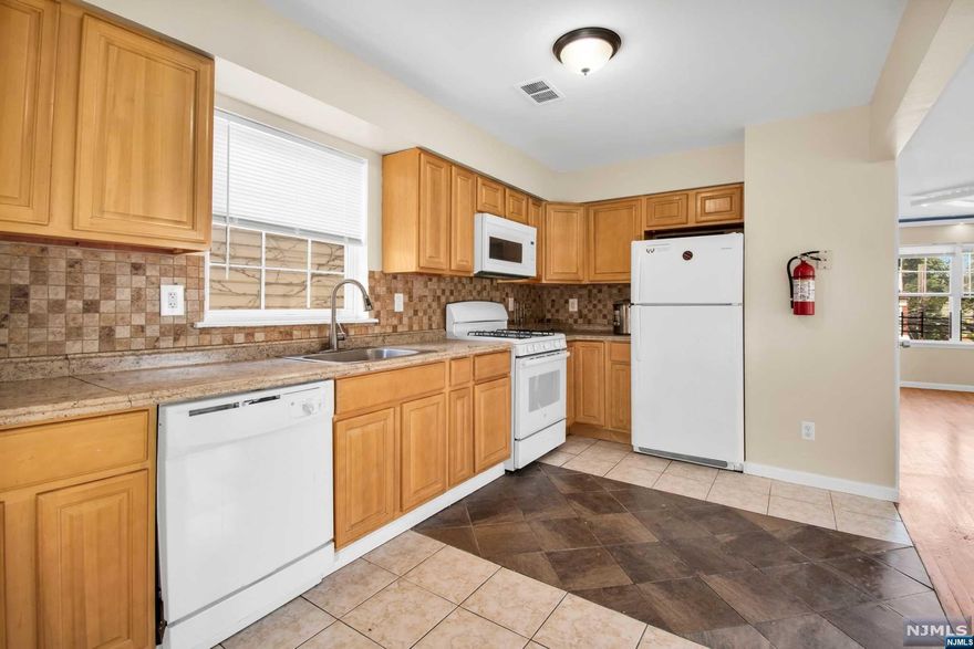 Welcome to your new 3-family home in Irvington! This well-maintained property boasts 7 bedrooms & 5 full bathrooms, with each unit equipped with central air & forced heat. Enjoy the convenience of a two-car garage, washer and dryer hookups, & a private fenced backyard. Ideally located just moments from the Garden State Parkway, this home is perfect for commuters. Whether you're an investor seeking a cash-flowing property or an owner-occupant looking to offset your monthly payments, this property is an excellent choice. The first unit is currently rented for $1,250, with market values ranging from $1,250 -$1,500. The second unit is rented for $2,500. The third unit is owner-occupied. Unit 2 & 3 have a market rental value between $2,500 -$2,700. Both the second & third units will be delivered vacant, offering immediate rental opportunities. This three-family home has the potential to generate a gross annual rental income between $75,000-$82,800. Don't miss out!