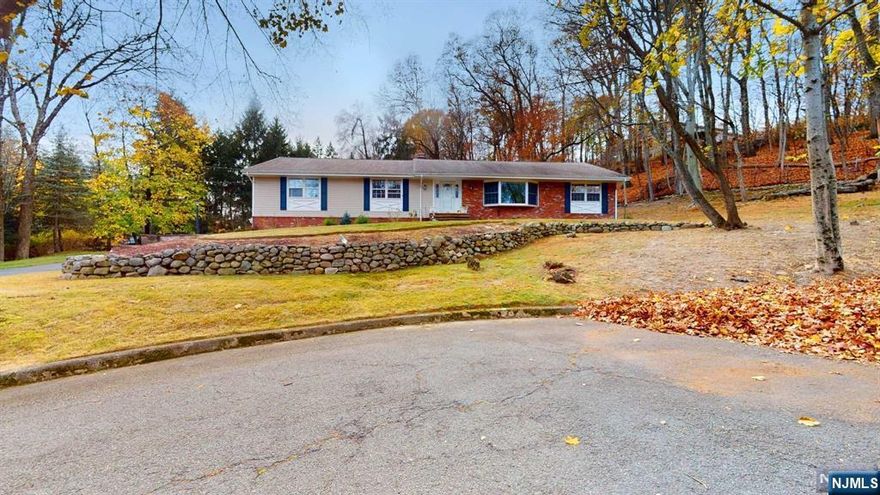 Discover the epitome of one-floor living in this exquisite custom ranch nestled in the heart of Woodcliff Lake's coveted school district. This stunning 4-bedroom, 2-full-bath home offers the perfect blend of comfort, style, and privacy on a spacious 0.5-acre cul-de-sac lot. Spacious and Bright: Enjoy an abundance of natural light throughout the home, with airy rooms and large windows. Elegant Living Spaces: The formal living room and dining room provide the ideal setting for entertaining guests, while the cozy family room with a brick wall wood-burning fireplace offers a warm and inviting atmosphere for family gatherings. The well-appointed kitchen is a chef's dream and ample counter space. Retreat to the master bedroom, complete with a private en-suite bathroom. The finished basement offers a versatile space for recreation, entertainment.The expansive lot provides plenty of room for an in ground pool. Enjoy easy access to NYC via train.A beautiful home in a prime location.