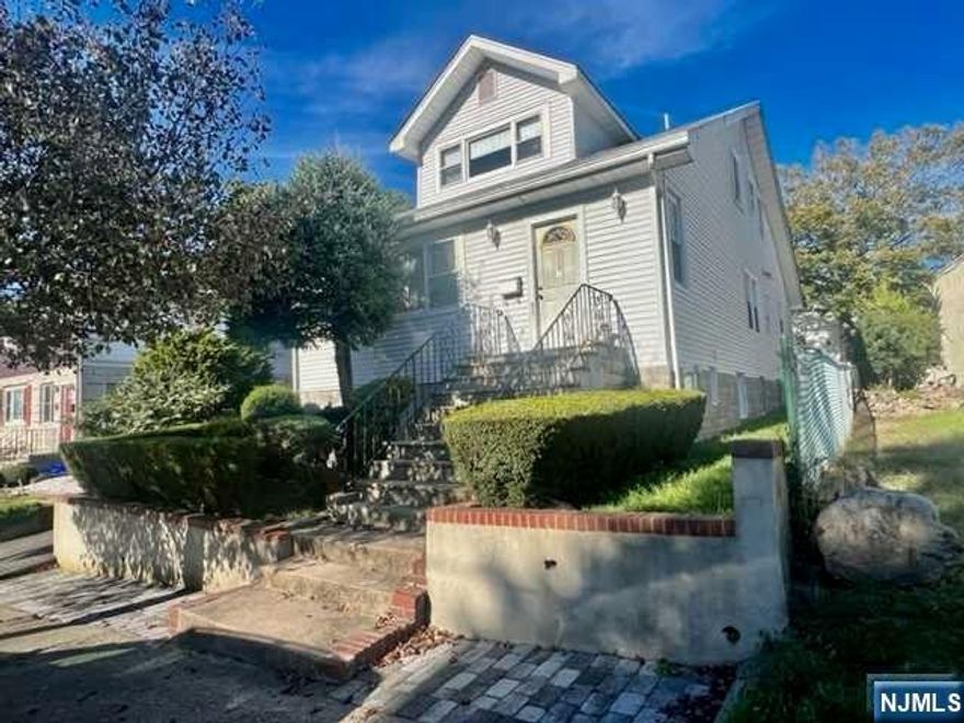 Call Emilia at 201-741-8445 Welcome to this well maintained two family. Sitting on an oversized lot, this home features entrance foyer, first floor four season room/home office, living room, large eat-in-kitchen with dining room overlooking secluded yard, three bedrooms and full bath. Step down to the ground level with family room, full bath and bedroom. This level has a private entrance. Second floor: Huge living room, large bedroom, laundry room, eat-in-kitchen and full bath. Main level has access to basement for laundry and utilities. Three car oversized garage and plenty of off street parking in the multi car driveway Walk to NYC transportation and just minutes to all major highways.