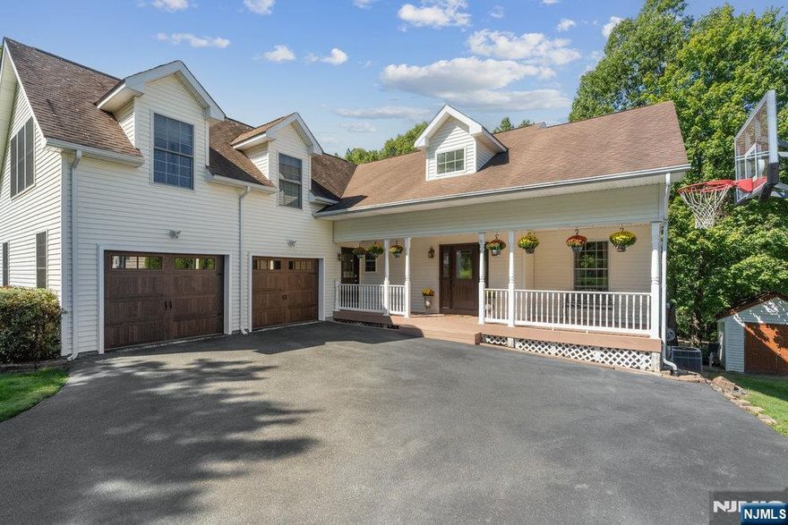 Welcome to this custom Colonial located in the desirable Alpine Estates development. Set on 1.3 acres, this approx 3,000 sq ft home offers the perfect blend of space and comfort. The first floor features an eat-in kitchen, a cozy family room with a wood-burning fireplace, formal living and dining rooms, a powder room, laundry area, and garage access. Step out onto your two-tier back deck and enjoy views of the spacious yard and the peaceful sounds of nature.Upstairs, the primary suite includes an ensuite bath and two walk-in closets. Youâ€™ll also find three additional bedrooms and a full bath.The fully finished basement offers flexible space with a home office or playroom, a large rec area, powder room, utility room, and ample storage. Walk out through sliding glass doors to an expanded patioâ€”perfect for entertaining.Additional highlights include hardwood flooring throughout the main living areas, central A/C, and forced hot air heating.