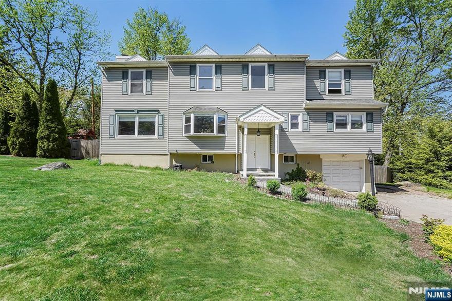 Welcome to this lovely unique spacious home. Discover the perfect blend of charm and functionality in this spacious 4-bedroom, 3-bathroom single-family house, offering approx 2,500 sq ft of living space on a desirable corner lot. The exterior features a welcoming front porch and a paver driveway leading to an attached garage. Inside, large bay windows flood the home with natural light. The private backyard is a true retreat, multi level deck, complete with an above-ground pool ideal for summer enjoyment. Located close to schools, shopping, dining, and public transportation, this property offers both comfort and convenience. Being sold strictly AS IS. SCHEDULE YOUR SHOWING TODAY!