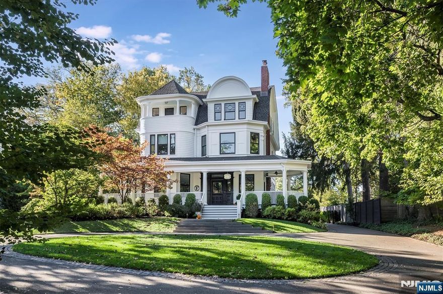 Welcome to one of Glen Ridge's most remarkable homes- an 1885 Queen Anne masterpiece featured in House Beautiful and other magazines, reimagined with warmth, sophistication and timeless style. Set on a gentle hill with a circular driveway, gracious wrap around porch and verdant landscaping, this 5 bedroom, 5 bathroom residence blends historic charm with modern luxury. The restoration and attention to detail on this home is architectural perfection. The heart of this home:a showpiece kitchen, featuring a massive black walnut and marble island with seating for 7, heated Moroccan tile floors, Miele appliances, triple bay sink with dual faucets and full bar area with sink, dishwasher and SubZero wine fridge. A stunning glass wall separates the kitchen from the seating area, perfect for morning coffee or evening conversation. Cozy family room with gas fireplace opens to a dining room with full glazed doors leading to an entertainer's deck and gracious, private, fenced backyard-seamless indoor-outdoor living.The luxurious primary suite boasts spa-like bathroom with soaking tub, heated floors, floor to ceiling medicine cabinet and sleek vanity. Dual dressing rooms- one with vanity and sink-plus custom cabinetry throughout. Convenient second floor laundry. The dramatic third floor features high beamed ceilings, 2 private bedrooms, a sweeping open space, full bath, plus dedicated office space. Super close to GR top rated schools, Midtown direct train, parks, and dining.