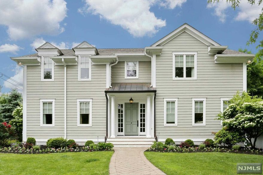 Rare opportunity to own a striking, pristine turn key colonial in the sought out desirable area on the East Hill. Enter into their grand hall between the formal, windowed dining room and living room with a dual fireplace to the step-down great room which overlooks landscaped backyard with stone patio.The gourmet eat-in Kitchen has custom cabinetry, SS appliances, large island and pantry. The side hall stairwell leads to large bedroom en-suite with a WI closet perfect for extended family. In hallway is laundry rm, convenient for easy access. A few steps down hall is the Primary suite w/ spa like bathroom, jetted tub, WI closet. To complete 2nd floor are 2 addl large bedrooms with WI closets & shared Jack Jill bathroom. The finished basement is a perfect retreat with a large rec room and perfect to set up a movie theatre rm. Basement has addl bdrm, full bath addl storage closets.Extras include a full generator, electric car charger, speaker syst. Close to schools, parks, NYC transp