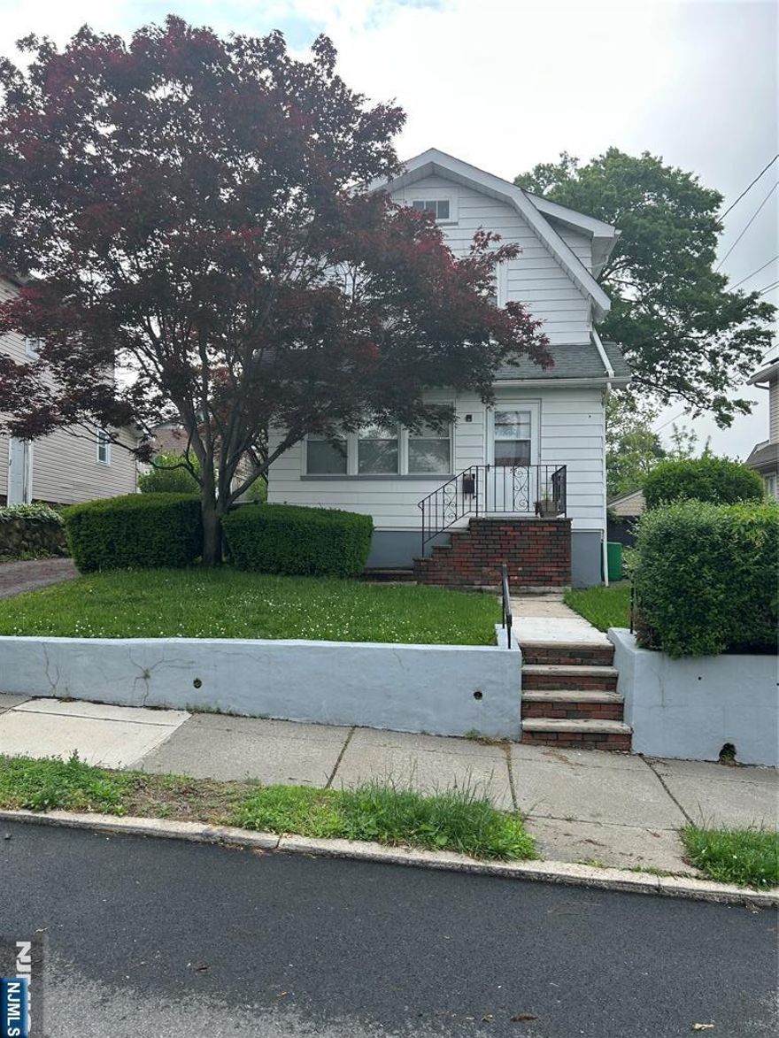 An incredible opportunity to own a home in a lovely Nutley neighborhood conveniently located near Lincoln School. This home offers a cozy sun porch, living room, dining room, kitchen and half bath on the first floor. There is a deck off of the kitchen for entertaining. The second floor has three bedrooms and a full bath. Additional highlights are a 4 car driveway and a full unfinished basement that you can finish and make your own.