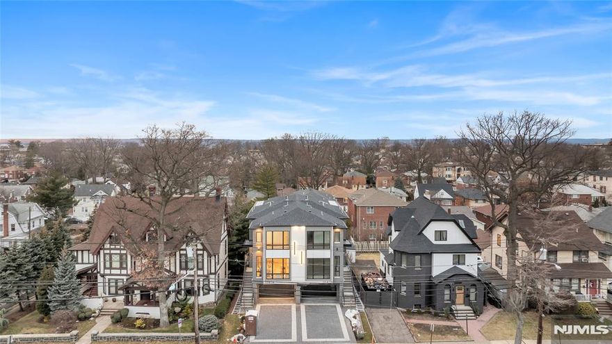 INTRODUCING 1047 ANDERSON AVE, AN OVER-SIZED, ONE OF A KIND, TOWNHOUSE FEATURING 4100 SQ FT, BUILT BY MB CUSTOM BUILDERS. THIS LUXURIOUS HOME BOASTS 3 LEVELS OF LIVING SPACE. MAIN LEVEL- 10' CEILINGS, OPEN CONCEPT, FAMILY ROOM WITH FIREPLACE HIGHLIGHTED BY WOOD AND BLACK ACCENTS, DINING ROOM, MODERN EAT IN KITCHEN OVERSIZED ISLAND, GE CAFE APPLIANCES, AND UNDER MOUNT CABINET LIGHTING, BUILT IN BREAKFAST NOOK, LIVING ROOM, AND SLIDING GLASS DOOR TO DECK....2ND FLOOR-PRIMARY BEDROOM WITH FIREPLACE, WALK IN CLOSET AND PLUS ADDITIONAL CLOSETS, OVERSIZED WINDOWS AND SPA LIKE BATH WITH HIS AND HER RAIN SHOWER AND TUB, 2 ADDITIONAL JUNIOR SUITES WITH WALK IN CLOSETS AND LAUNDRY COMPLETE THE 2ND FLOOR. GROUND FLOOR- RECREATION ROOM WITH 12â€™ CEILINGS, FULL BATH, SLIDING GLASS DOOR TO A NICE SIZE YARD, GARAGE, AND MUDROOM....ADDITIONAL FEATURES-MULTI ZONE HEATING AND COOLING, CUSTOM MOLDINGS THROUGHOUT AND MULTI ZONE SPEAKER SYSTEM.