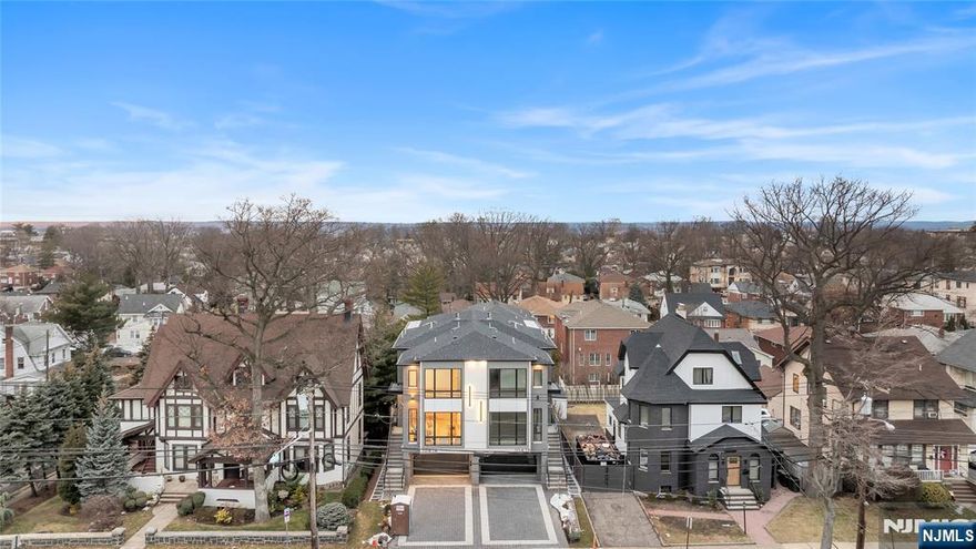INTRODUCING 1047 ANDERSON AVE, AN OVER-SIZED, ONE OF A KIND, TOWNHOUSE FEATURING 4100 SQ FT, BUILT BY MB CUSTOM BUILDERS. THIS LUXURIOUS HOME BOASTS 3 LEVELS OF LIVING SPACE. MAIN LEVEL- 9' CEILINGS, OPEN CONCEPT, FAMILY ROOM WITH FIREPLACE HIGHLIGHTED BY WOOD AND BLACK ACCENTS, DINING ROOM, MODERN EAT IN KITCHEN OVERSIZED ISLAND, GE CAFE APPLIANCES, AND UNDER MOUNT CABINET LIGHTING, BUILT IN BREAKFAST NOOK, LIVING ROOM, AND SLIDING GLASS DOOR TO DECK....2ND FLOOR-PRIMARY BEDROOM WITH FIREPLACE, WALK IN CLOSET AND PLUS ADDITIONAL CLOSETS, OVERSIZED WINDOWS AND SPA LIKE BATH WITH HIS AND HER RAIN SHOWER AND TUB, 2 ADDITIONAL JUNIOR SUITES WITH WALK IN CLOSETS AND LAUNDRY COMPLETE THE 2ND FLOOR. GROUND FLOOR- RECREATION ROOM WITH 12â€™ CEILINGS, FULL BATH, SLIDING GLASS DOOR TO A NICE SIZE YARD, GARAGE, AND MUDROOM....ADDITIONAL FEATURES-MULTI ZONE HEATING AND COOLING, CUSTOM MOLDINGS THROUGHOUT AND MULTI ZONE SPEAKER SYSTEM.