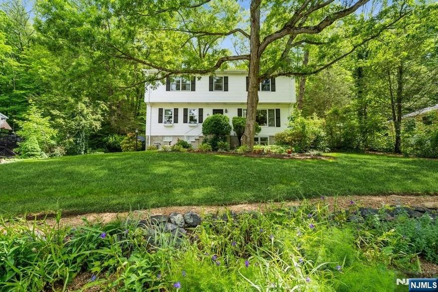 Nestled in the peaceful and picturesque neighborhood of Cupsaw Lake, this beautiful home offers the perfect blend of comfort, nature, and year-round enjoyment. Cupsaw Lake is a stunning 65-acre freshwater retreat in Ringwood, New Jersey, ideal for those who cherish all four seasons.Step outside from the kitchen into your private backyard oasis, featuring a paver patio and vibrant perennial garden,perfect setting to enjoy breakfast, lunch, or dinner in a tranquil, park-like atmosphere.Inside, the home showcases a modern, updated kitchen complete with stainless steel appliances, a pantry, and cabinet organizers. The main level offers an open and inviting layout with a spacious living and dining area with a cozy fireplace, an additional family/TV room with a wood burning fireplace, a full bathroom, and elegant hardwood and tile flooring throughout.Upstairs, you'll find three generously sized bedrooms, a full hall bath, and a primary suite with its own full bathroom ensuring space and comfort for everyone.The finished basement adds valuable flex space, perfect for a home office, gym, playroom, or creative studio.It includes heat, a half bath, and a walkout to an oversized garage that's ideal for large vehicles or recreational equipment. With two electric panels, the space offers flexibility for future customization.This home truly checks all the boxes style, space, flexibility, and a prime location in one of Ringwood's most desirable communities.Don't miss your chance to enjoy.