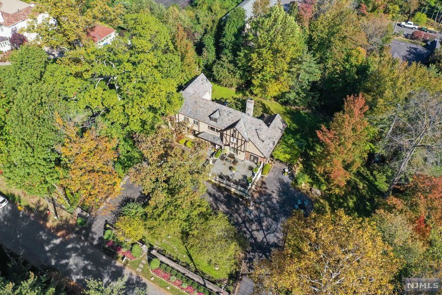 One of the largest properties in Englewood Cliffs and in one of the best locations. House can be renovated and expanded. Huge deck off the kitchen and foyer overlooking beautifully landscaped lot. Must Be Seen!