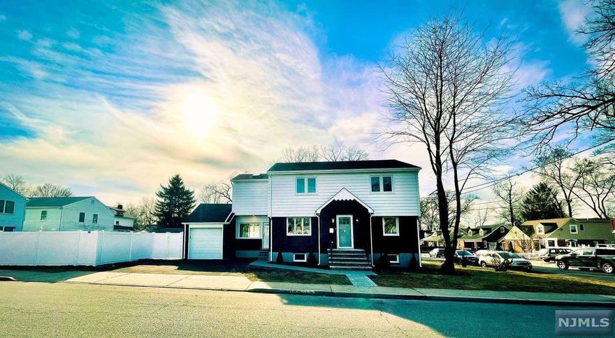 This luxurious fully renovated approximately 3,000 sq. ft. 4 bedroom (plus office/nursery), 3.5 bath home features impeccable hardwood floors throughout, recessed lighting, quartz countertops, S/S appliances. Washer and dryer connections on bedroom level and fully finished basement. Master bedroom with en suite bathroom provides a Jacuzzi tub, oversized separate shower, double vanity and skylight. Renovations include all new flooring, plumbing, fixtures, kitchen, electrical, roof, windows, dual-zone central air. 1 minute drive/8 minute walk to Honiss Elementary School. 1 minute drive/4 minute walk to Veterans Memorial Park. 2 minute walk to NYC Bus Stop.