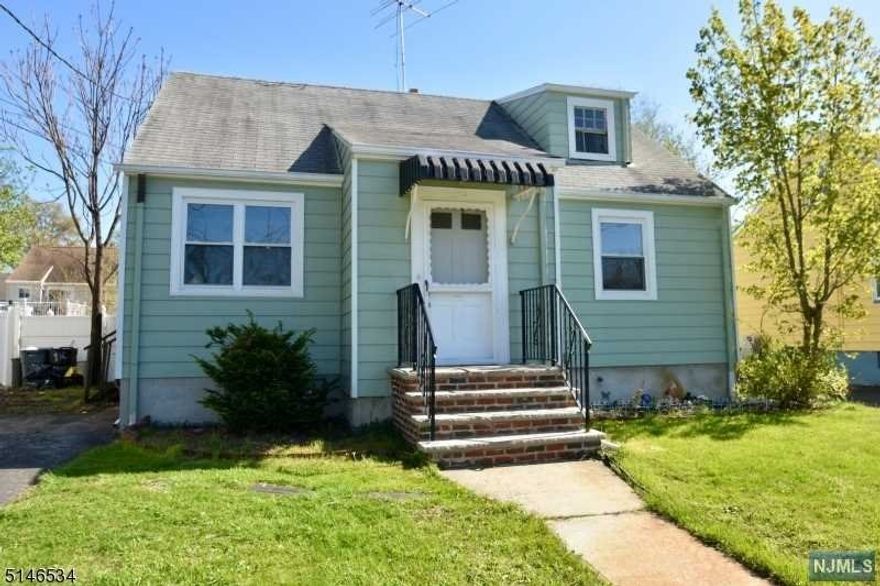 Charming cape neatly situated on a level fenced lot. Centrally located on a quiet street, this home has much to offer. Kitchen boasts stainless steel appliances and granite countertops. Gleaming hardwood floors flow throughout the first floor including the living room and two comfortable bedrooms. The full bath will have a new medicine cabinet installed soon. Upstairs there is one more full bedroom and an office area with all new carpeting. The full finished basement is tiled and could be a wonderful recreation area, and has s full bath! The back yard is fenced and offers a patio, garden area and storage shed. This one checks all the boxes!