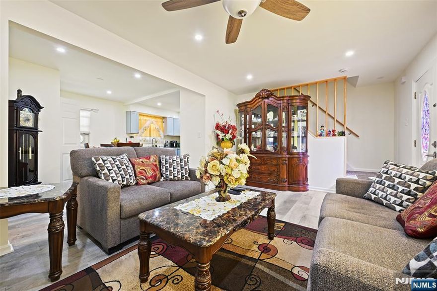 SELLER IS MOTIVATED and OFFERING $10,000 towards CLOSING COST, and is willing to negotiate! This beautifully renovated Cape Cod home offers timeless charm blended seamlessly with modern updates. Nestled on a spacious lot, the property features a wide multi-car driveway, perfect for accommodating guests or a growing household.Step inside to discover a warm and inviting layout. The living area features gleaming hardwood floors, recessed lighting, and a cozy ambiance ideal for relaxing or entertaining.The kitchen is a true showstopper, featuring quartz countertop, custom cabinetry, and stainless steel appliances, manicured backyard. across the street from Shoprite supermarket, walking distance to Parks, Train and Bus.