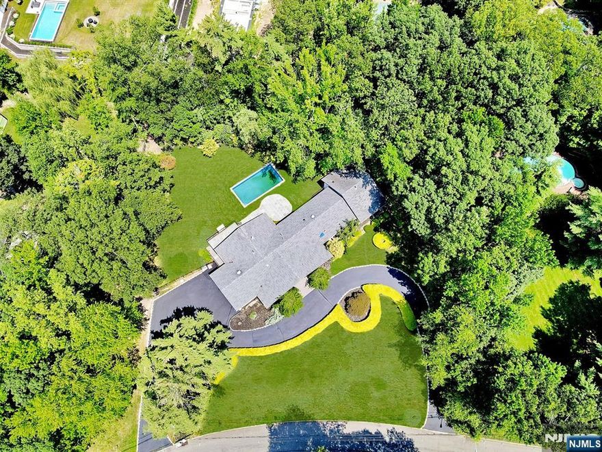Contact The listing agent Anat at 201.3441.4765-Prepare to be wowed by this extraordinary, gut-renovated, bright, modern ranch with panoramic vistas on Tenaflyâ€™s East Hill. This 6-bedroom, 5.5-bathroom home boasts a blend of easy living and luxury. It is situated on over an acre of landscaped grounds. From the sleek new stucco and Black brick exterior to the brand-new in-ground pool, this home has been transformed from top to bottom. Inside, the state-of-the-art kitchen is a chefâ€™s dream, outfitted with top-of-the-line appliances, including a Sub-Zero fridge and freezer, Bosch cooktop, 2 Bosch dishwashers, 2 Ovens, and a wine cooler. The sun-drenched living room offers views of a park-like backyard and pool. The family room, anchored by a sleek gas-burning fireplace, opens to an expansive patio. The lavish primary suite features a spacious 2 WIC and an oversized spa-style bathroom. The basement features a gym, a home theater, two additional bedrooms, and a full bath.