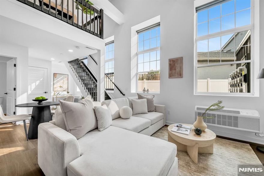 * HOLIDAY SPECIAL - ONE MONTH FREE ON A 13 MONTH LEASE OR 2 MONTHS FREE ON A 15 MONTH LEASE IF SIGNED BEFORE 12/15 & $1000 SECURITY DEPOSIT * Discover pure luxury in this stunning, new construction 1 Bedroom Loft / 2 Bathroom apartment conveniently located in highly sought after East Rutherford. Stretching across 958 SqFt, this brand new unit features lofted ceilings, gleaming wood floors, in unit washer/dryer, multi-zone heating and cooling, and plenty of sunlight throughout the day. First floor includes entry foyer, kitchen, living room, dining room, full bathroom, and laundry. Chef's kitchen features SS appliances, custom cabinets, quartz countertops, and breakfast bar. Completing this beautiful home is a second floor with bedroom, ensuite bathroom, and walk-in closet. 315 Railroad is a one-of-a-kind building featuring virtual doorman, resident patio, dog run, and ample parking. Conveniently located just steps from downtown East Rutherford & Rutherford, NJ Transit train station and bus stop, restaurants, shopping, parks, and schools. This rare opportunity is one you don't want to miss! * HOLIDAY SPECIAL - ONE MONTH FREE ON A 13 MONTH LEASE OR 2 MONTHS FREE ON A 15 MONTH LEASE IF SIGNED BEFORE 12/15 & $1000 SECURITY DEPOSIT *