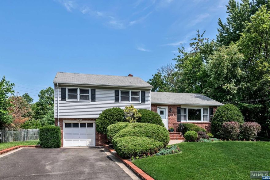 Immaculate and bright split level three big bedrooms,updated main tile bath, two powder rooms, one in primary suite and one off the lower level ofc/fam rm. Oversized formal living room with pretty wood floors and all day sun! Formal dining room with outside entry to yard. Cheerful eat-in kitchen overlooks fenced rear yard. New carpet on stairs to family rm/ofc with built in bench and bookshelves, laundry area and 1/4 bath, outside entry to patio/yard w/electric retractable awning! Big lower level basement with high ceilings, current workout room, storage, dryer, HVAC. Cool central air, just serviced by contract w/Reiner. Beautifully landscaped, well-maintained, freshly painted interior. Convenient to schools, town, local commerce. Make it your own!