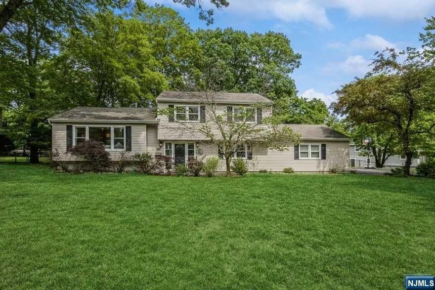 SUPER DESIREABLE BROADLAWN home on .4 Acre LEVEL Lot in MOST PRESTIGIOUS Livingston! Enjoy OPEN CONCEPT Kitchen w/Breakfast Bar and SS appliances with EASY FLOW to Dining Room and BRIGHT Formal Living Room. 2nd Level hosts MASTER Bedroom w/Full Bath and 3 Closets + 2 Add'l BRs and RENOVATED Hall Bath. Ground Level incl Family Room w/Walkout to PRIVATE Yard, 4th Bedroom and Powder Room. Full 450+ sq ft Unfinished Basement w/Laundry & Storage. WELL-MAINTAINED Home w/Newer Windows, TIMBERTECH Deck, Newer Water Heater, AC Unit & Tesla Charger. Mt Pleasant Schools, NYC Bus and Town Center are AROUND THE CORNER!! MOVE right in and Enjoy life!