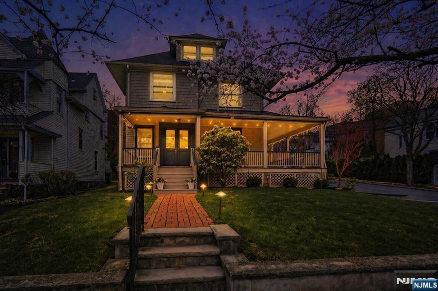 This stunning and spacious Victorian set on a corner lot, lined with charming cherry blossom trees, embodies the sought-after Montclair lifestyle, where the city meets the suburbs. Timeless architectural details greet you at the wraparound porch before entering the double-door vestibule, leading to a grand foyer and impressive staircase. Rich in historic charm - crown moldings, decorative trim, stained glass windows - all thoughtfully integrated with modern updates. Custom built-ins frame the formal study, flowing seamlessly into the dining room with stunning fireplace and large windows that fill the space with natural light. Bright, inviting kitchen offers stainless steel appliances, quartz countertops, and a breakfast bar that opens to a relaxed living area. Full bath and powder room complete the 1st floor, ideal for entertaining. The 2nd floor features four bedrooms and two full baths, including oversized primary, while the 3rd floor offers two additional bedrooms perfect for guests or home office, plus a large walk-in storage room. Basement includes addtl. storage, gym space, laundry, and utility areas. Outside, a serene private patio and gated yard w/ fountain and lush landscaping evoke an English garden. Rare 3-car garage, paved driveway, and bonus shed provide ample parking and storage. Ideally located near the Library, Wellmont Plaza, Chvrch Street, Montclair Center, Bay St and Walnut St NJ Transit. This lovingly maintained 1897 home is a true architectural gem!