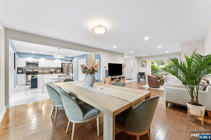 This stunning residence was completely renovated in 2019 and offers a seamless blend of style and comfort. Enter through the marble-floored foyer that leads directly into the kitchen. The home features brand-new hardwood floors, energy-efficient windows, and sliding glass doors throughout. The inviting living room showcases a striking new stone fireplace, while the open-concept dining room flows easily into the gourmet kitchen. The kitchen is equipped with granite countertops, stainless-steel appliances, a spacious center island, and ample cabinetry, plus sliders that open to a large deck â€” perfect for entertaining. A generous walk-in pantry and a convenient laundry room sit just off the kitchen. Updated bathrooms boast modern finishes, and abundant closet space can be found throughout the home. Each bedroom offers large walk-in closets, and the expansive family room features its own set of sliders leading to a private patio. Additional highlights include an attached garage with direct access to the foyer, new lighting fixtures and recessed lighting throughout, stylish window dressings, and a new hot water heater installed in 2021.