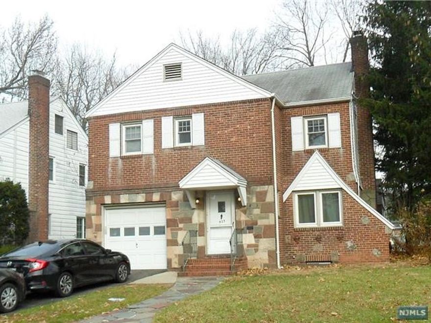 Spacious Colonial featuring large living room with wood burning fireplace, Formal Dining Room, large EIK with breakfast nook. Additional family room/or home office, powder room and attached 1 car garage. Renovated basement with a legal bedroom and full bath with double sink. Lots of closet and storage space, living room/Rec room. Enter to the second floor through a wide staircase which has 3 bedrooms, full bath & master bedroom with master bathroom. Laundry hookup is on the second floor as well. Third floor is a large attic great for storage. Central Air conditioning throughout the home and new heating system (3 zones). Basement has French drains and sump pump. Nice fenced in yard.