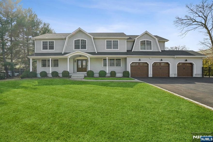 Welcome to this stunning 2017 rebuilt 5-bedroom, 4.5-bath center hall colonial nestled in a peaceful cul-de-sac on 1 acres of land. This gem has been meticulously & lovingly updated & cared for. 1st level offers a welcoming double height EF, formal DR, formal LR, office/den, and a stunning eat-in kitchen overlooks a breathtaking backyard. The two story great room is ideal for relaxing & entertaining, boasting custom woodwork and fireplace. The in-law/guest suite with its own entrance offers a good size bedroom, FB and a sitting area. Access the 2nd floor where you'll find an oversized primary suite with two large walk-in closets, a junior suite, and two additional generously sized bedrooms along with a FB and laundry. The expansive finished basement offers additional living space, ample storage and a 3-car garage with an electric charger. 4 zone AC, new septic, whole house generator, 2 tankless water heaters and much more! This home truly reflects the pride of ownership at every turn!