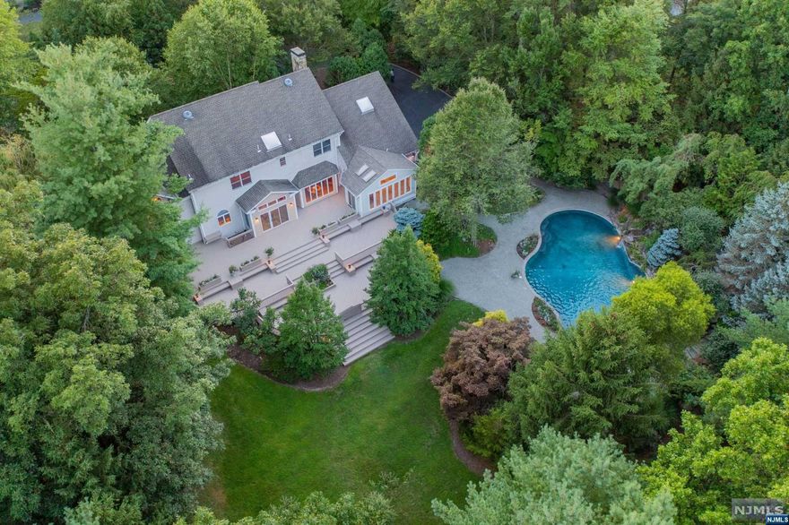 PERFECTLY SITUATED IS THIS 1.6 ACRE PRIVATE ESTATE OFFERING OVER 7K SQ FT INCLUDING THE FINISHED LWR LEVEL! NESTLED BEHIND LUSH LANDSCAPE IS YOUR OWN PRIVATE RETREAT W/CSTM POOL W/3 WATER FEATURES, OVERSIZED CUSTM DECK & AN ABUNDANCE OF GREEN SPACE. THIS 5 BEDROOM CUSTOM HOME IS LIKE NO OTHER, NO EXPENSE WAS SPARED TO CREATE THIS HAVEN OF NATURE & TRANQUILITY. CSTM DOORS, 2 STAIRCASES, CUSTM TRIM WORK & 3 FP'S. 2 STRY EF, LR W/HAND CRAFTED FP, OVRSZD KITCH OVERLOOKS REAR YARD & CSTM 2K SQ FT DECK. DR W/PRIV ENTRY TO YARD, FAM RM W/FP, OFFC/LBRY W/BLT INS. SUN RM,LNDRY, MUD RM, FULL BATH & PR COMPL THE 1ST FL. 2ND FL W/OVRSZD LANDING OFERS 5 CSTM BR'S. THE PRIM SUITE IS YOUR OWN PRIV ESCAPE,CSTM BEAMED CLGS, FP,LUX BTH W/STONE SHWR,RAIN HEAD,THERAP SOAKING TUB, & DUAL VNTS.1 BR ENST, 3 LARGE BR'S, JACK N JILL & FL BATH. THE LWR LEVEL IS EQUALLY IMPRESSIVE W/CSTM MEMORABILIA AREA, BILLRD RM, MEDIA AREA, BNS RM, WINE RM,SMR KTCH, FL BTH. CIRC DW, NEW 5 BR SEPTIC TO BE INSTALLED