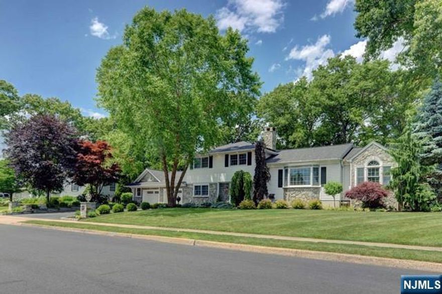 Welcome to this beautifully updated Split-Level Style home, located in a desirable neighborhood of Wayne. Eat-in kitchen with granite countertops and stainless steel appliances with sliding door that walks out onto deck overlooking a gorgeous in-ground pool. Covered Patio and park-like, fenced-in yard. Perfect for entertaining! Spacious primary bedroom with ensuite. Pristine hardwood floors in many areas throughout this updated home! Finished basement great for play area, gym or home office. Two car garage with ample space and a large driveway. Come and see this amazing, turn-key home today!
