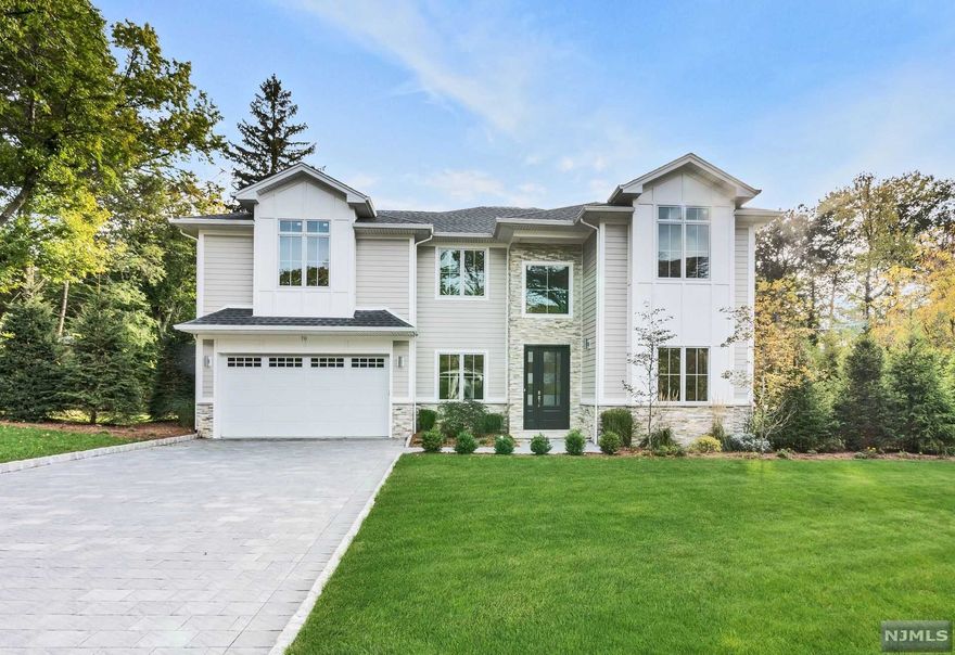 Exquisite, East Hill Colonial built in 2017 on partial existing foundation. Home features a 2 story entrance, beautiful floating staircase formal living room w/tray ceiling, dining rm with coffered ceiling, 2story great room w/fireplace & French door to limestone patio & yard, chic open concept kitchen, Quartzite countertops, Wolf range, Sub-Zero refrigerator, wine refrigerator and powder room complete the first floor. Second floor has an impressive master bedroom with tray ceiling, master bath w/over sized shower, stylish free standing tub, double sink vanity and walk in closet, 1 bedroom w/full bath,2 bedrooms, hall bath, laundry room. Full finished, walk out basement has a gorgeous porcelain floor, bedroom, full bath, recreation room. Security system, 2car garage, central vac, Porcelanosa tile baths, wide plank oak floors, 10' ceilings on 1st floor, 9.5' ceilings on 2nd floor, Hardiplank style siding & upscale finishes throughout this impressive home. Come see for yourself