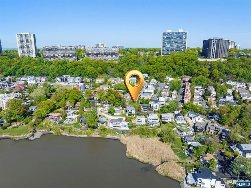 One of the best locations in Edgewater to build your dream home, that is complimented by one of the best contemporary house designs, to be built on it. Vista Lane is a quite non-throughfare road in The "Edgewater Colony" directly across from River Palm restaurant. This gorgeous parcel of land comes with approvals to build a 3,500 sq. ft. Contemporary house. It consists of 3 levels with an elevator shaft, formal dining room, full basement, large outdoor hot tub, several decks with views, and a 2 car garage.