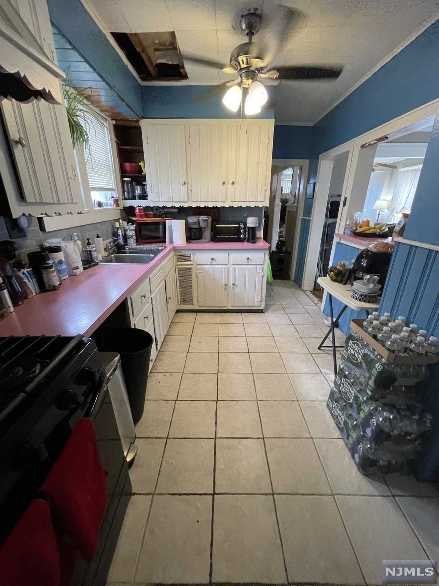 Property with 3 bedroom 1 bath, colonial with a finished (though outdated) attic. The basement is not finished, the roof is 2 years old and so are the mechanicals. It has a detached garage with a long driveway on a dead end street. 2 Blocks away from Bogota High School and 1 block away from "Main Street"