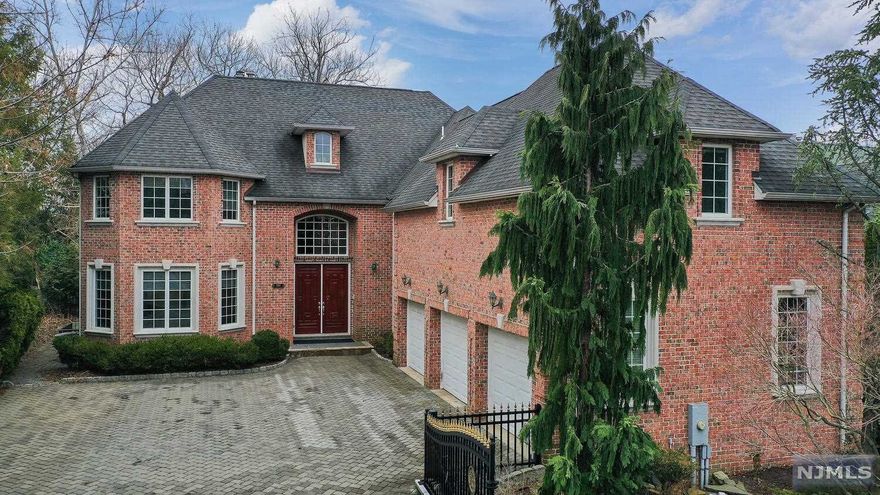 Everything you've ever dreamed of in a luxury home. Enter through the main doorway into the grand two-story foyer. Open layout includes wonderful formal living room, oversized dining room which flows to the family room and high-end kitchen. Kitchen includes top of the line appliances, granite countertops, center island, wine fridge & more. Family room features cathedral ceilings, tons of natural light and wood burning fireplace. First floor also has a beautiful office with French doors for those that want their own private working space. The opulent staircase leads to 4 bedrooms each with ensuite bathroom. The impressive primary bedroom has a fireplace, spa like master bath, 2 walk in closets and a spectacular city view which is rare to find and not to be missed. Other amenities in this home include radiant tile floors, new heating system, fully finished basement with separate rooms and full bath, 3 car garage and the final show piece a spacious tranquil yard with coy pond & patio