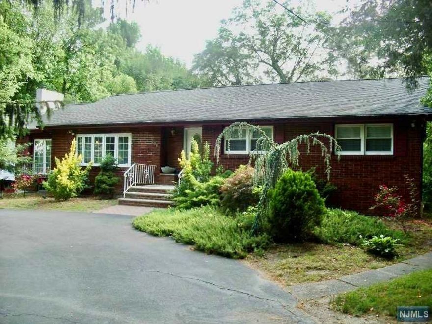 Spacious Waterfront Brick Ranch,Enjoy one floor living with Custom Home boasting a Sunken Living Room,Family Room,Formal Dining Room w/Fireplace,Modern Gourmet Kitchen has Vaulted Ceiling,Granite Countertops,Center Island Top of the Line Stainless Appliances,Sliders to the New Trex Deck which leads to the recently renovated Backyard Oasis complete w/Inground pool and Hot Tub.Partially Finished Basement, New Roof and AC.