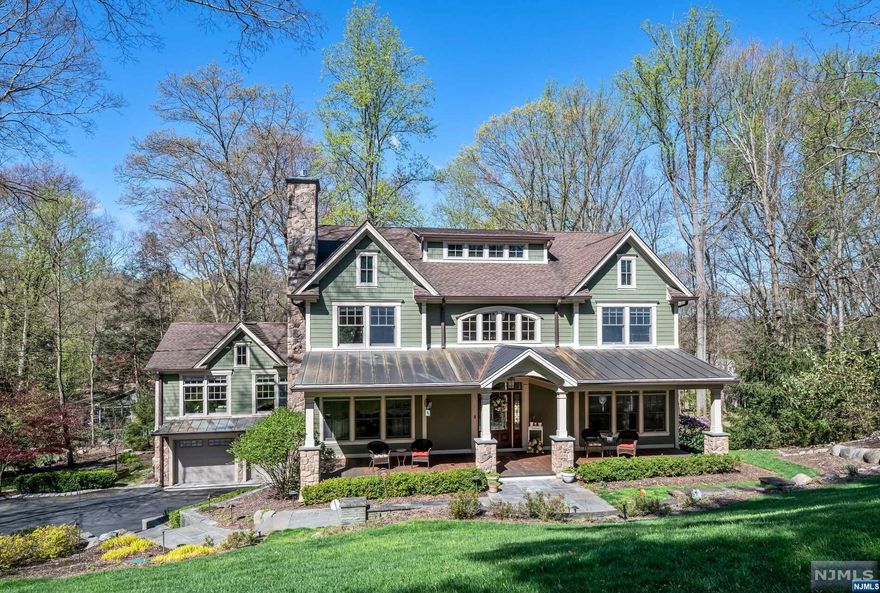 Pines Lake Colonial! Totally renovated & rebuilt in 2011! A covered rocking chair porch welcomes you, the door opens into a beautiful 2 story foyer. The spacious kitchen with custom cabinets & black granite counters is a dream with a huge center island, breakfast room & family room all in one large open living space. Top of the line Wolf, Bosch & Viking appliances. Beautiful hardwood floors throughout. There are doors to the rear deck overlooking the yard. The adjacent Great room features a vaulted ceiling, fireplace & walls of windows creating is an ideal place to relax. The living room has a fireplace & there is a beautiful formal dining room 20x12. There is a first floor bedroom with ensuite bath, plus a guest power room.The 2nd floor primary suite features a sitting room, huge walk in closet & spa bath. 2 additional 2nd floor bedrooms share a full bath, plus 2nd floor laundry. The basement is finished with a huge game room, wet bar, full bath. Lake living at it's best!