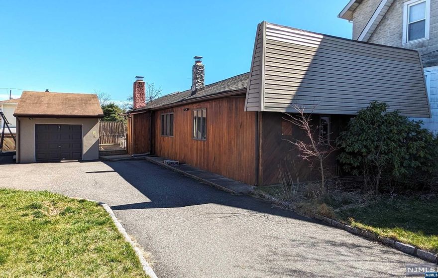 Modern ranch for a single family. Living room and dining room with a large eat--in kitchen, and two spacious bedrooms, each having a full bath attached to it. Master bedroom has his and her room-length, furbished closets; its bathroom has whirlpool tub plus separate shower. Secondary bedroom has a walk-in California Closet. Central air conditioning plus natural lighting from three skylight windows give more privacy. Semi-finished full basement has a wood-burning fireplace, recreation area, and more closet space. This home has its own personality. Deck (with awning) leads to detached garage and large driveway. It is a short walk to bus stops, center of town, and the park. Property is not in the flood zone.