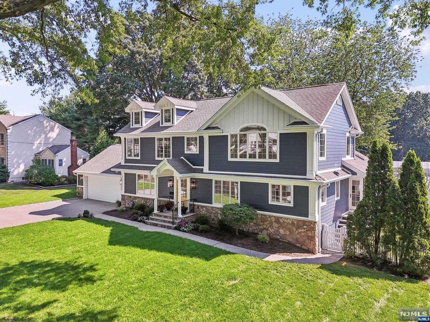 FULL GUT RENOVATION in 2024! Modern colonial on one of the most desirable locations in Glen Rock, only a block away from top ranked Schools. 3,600+ SQFT of living space (incl/basement) w/ Open and functional floor plan. EF welcomes you to a formal LR/FPL, DR w/bar, Gorgeous Kitchen w/beautiful quartz countertops, large island and large Pantry room that Opens to a Bright Family Room w/FPL, skylights and sliding doors w/access to a nice deck and fully fenced Backyard. A convenient 1st floor BR and a beautiful Bath complete this floor. 2nd level offers 2 spacious BR w/walk in closets, elegant main Bath, private Den/office w/French doors and a large Primary Suite w/ luxurious spa like Bath and plenty of closets. THE FOLLOWING ARE NEW- electrical, plumbing, HWH, white oak wood floors, Anderson windows, Hardie Siding, All Bath w/designer tile, Lux Kitchen walnut cabinets, contemporary FPLs. Beautiful Lighting, Foam and Sound insulation... 2 car GAR w/EV, generator...Seller holds RE Lic