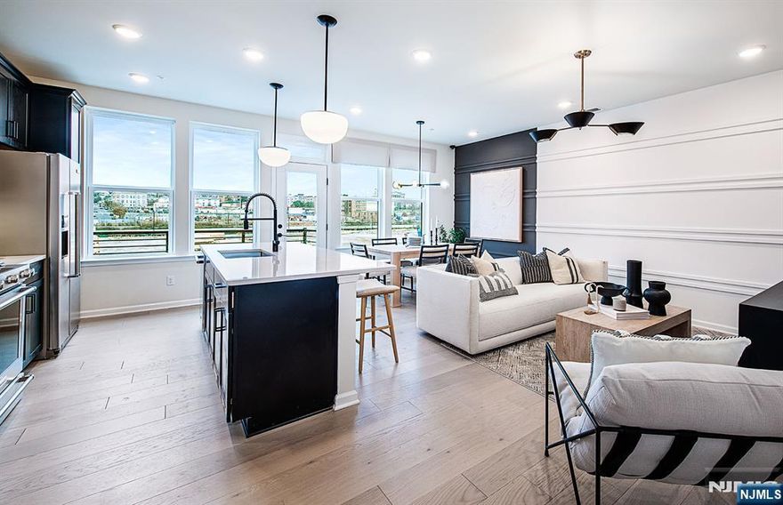 Discover a vibrant blend of comfort, convenience, and connection at Bridgeview - a stunning new construction townhome community in commuter-friendly Kearny, NJ. Perfectly positioned for effortless travel, Bridgeview offers quick access to major highways, the PATH train to NYC, and Newark Liberty Airport - making it an ideal home base for busy professionals and frequent travelers alike. This beautifully designed Union Townhome features 3 spacious bedrooms, 2.5 bathrooms, and is thoughtfully set away from the main road, offering a peaceful retreat with added privacy. Inside, you'll find open-concept living areas, sleek modern finishes, and low-maintenance design - creating a space that's both stylish and functional. Step outside your door and enjoy resort-style amenities, including a sparkling pool, fitness center, elegant club room, co-working lounges, outdoor grilling areas, dog runs, and a shuttle to the PATH station. Plus, you're just a short stroll from everyday essentials and local favorites like Starbucks, LA Fitness, ShopRite, Target, BJs, and a variety of dining and entertainment options. Whether you're seeking elevated living, unbeatable convenience, or the perfect commuter location - the townhomes at Bridgeview check every box.