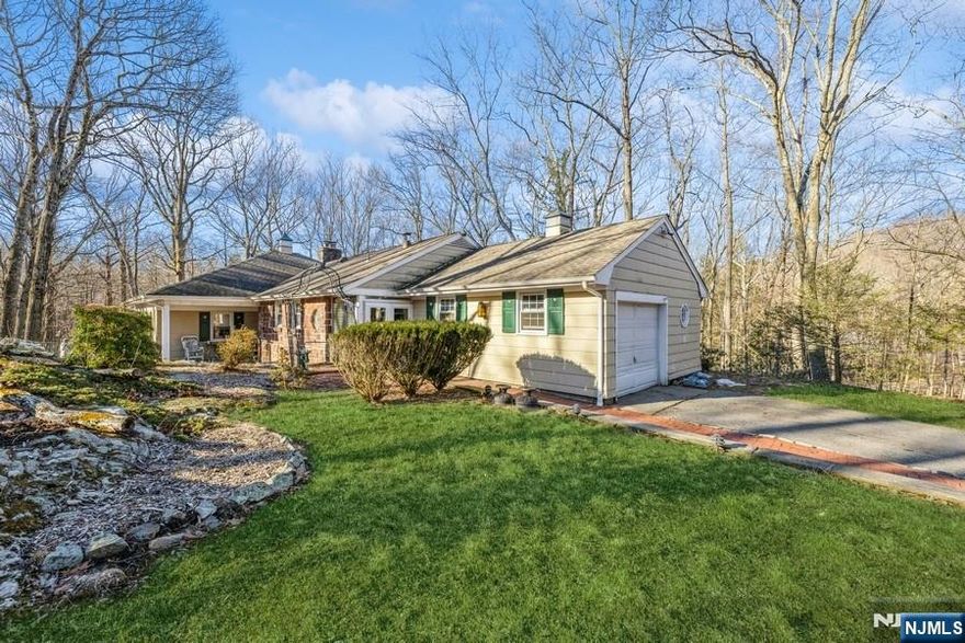 Escape to nature in this spacious and unique rustic home nestled on a large, private wooded lot in the heart of Kinnelon. Surrounded by serene landscapes and mature trees, this one-of-a-kind residence offers the perfect blend of tranquility and convenience. Step inside to find expansive living spaces with warm wood accents. Experience the ease and comfort of ranch-style living, with every room conveniently located on a single level. The primary bedroom ensuite offers the added indulgence of a heated floor, creating a warm and welcoming retreat.The home's distinctive character and generous layout provide ample room for relaxation. Large windows bring in plenty of natural light and offer picturesque views of the surrounding forest. Located in the highly desirable Kinnelon school district, consistently ranked among the top in New Jersey. Outdoor enthusiasts will love the proximity to hiking trails and parks, making it an ideal retreat for those who appreciate nature and the great outdoors. Despite its peaceful, secluded setting, this property is conveniently close to local shops, restaurants, and major roadways for an easy commute. If you're looking for a spacious, character-filled home in a beautiful natural setting, 147 Kinnelon Road is the perfect rental for you. Don't miss this rare opportunity schedule a showing today!