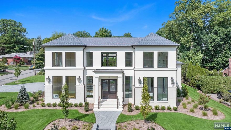 Introducing 15 Loretta Court, an exquisite French Contemporary situated on a spacious corner lot in the North Cliffs. This new construction 5 Bdrm, 5.5 Bath boasts elegance and sophistication in every detail including vaulted 20' ceilings and floor-to-ceiling windows that flood the interior with natural light, Oak wood floors throughout, open-concept gourmet kitchen is a chef's dream, equipped with designer appliances and a chic butler's pantry, light-filled dining room and powder room featuring a one-of-a-kind stone wall that sets the tone for luxury from the moment you enter. Four out of the five bedrooms boast en-suite bathrooms and outfitted closets. Additionally, the first floor offers the flexibility of a library/home office, catering to your specific needs. Basement equipped with a stunning bar, space for either a billiard room or gym, in addition to a full bedroom and full bath. Backyard includes a cover patio with fireplace.