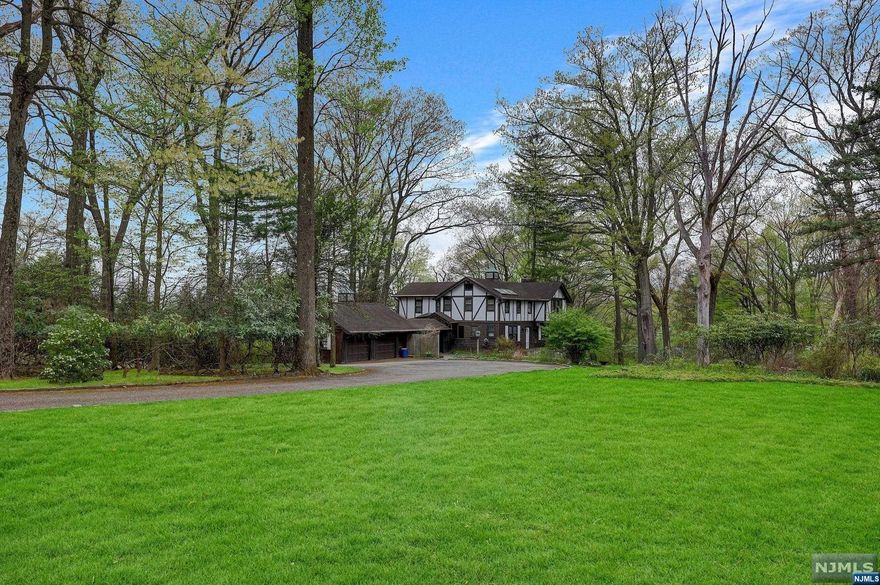 A rare opportunity for a builder or buyer to build a custom estate on a private, picturesque 1.716 acre property perched up in beautiful Alpine. Located in one of America's most prestigious zip codes in Bergen County! This unique property backs up to one of Alpine's most magnificent 8-acre estate, with total privacy and unlimited possibilities! Not only does Alpine have the lowest tax rate in Bergen County, but their school is rated #1 public elementary school in Bergen County and Tenafly HS is a national Blue Ribbon School. The existing 5 bedroom, 4 bathroom home is in livable condition. Minutes to the George Washington Bridge to Manhattan & the Palisades Parkway to NY State, with easy access to major highways and airports. Alpine is close to some of the finest restaurants, Golf and Country Clubs in the area!!