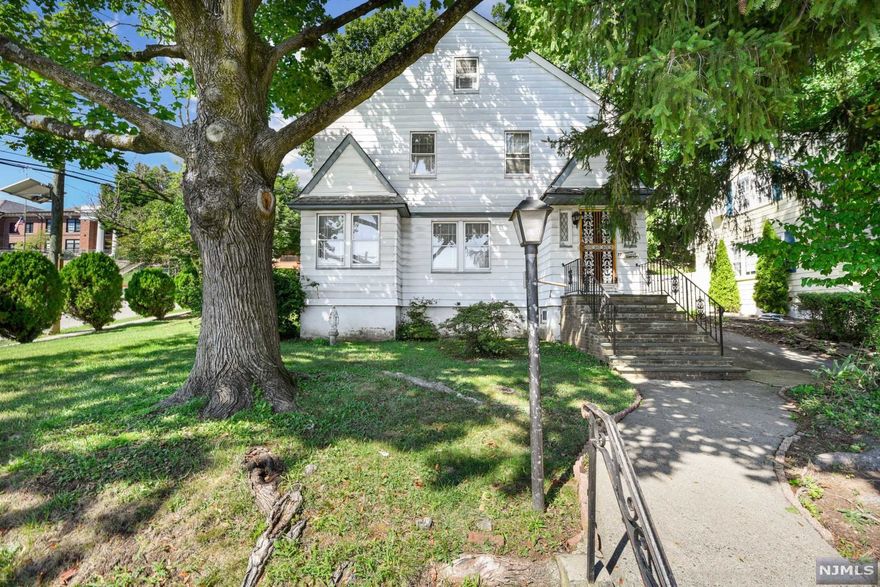 Opportunity knocks on this traditional side hall colonial sitting on an amazing corner lot. A formal floor plan throughout the home with natural light filling the rooms. The large living room welcomes you as you walk into this home; offers a ton of space for entertaining or relaxing with your loved ones, while featuring a wood burning fireplace. The formal dining room is located directly across from your kitchen making it even easier to host your guests. The eat in kitchen offers a ton of storage space featuring two pantries. Enjoy year round outdoor living with the attached sunroom located right next to the mud room entry. The second and third level host 3 very nice size bedrooms and one full bathroom, buyer can easily add an additional full bath on third level, if needed. Hardwood floors underneath carpeting throughout the home. Located next to Elementary School, close proximity to shops, restaurants, Seton Hall and major highways such as 280 and Parkway. Easy commute!