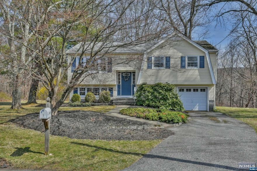 Well maintained bi-level on quiet cul-de-sac in Oak Ridge section of Jefferson Twp. Look out the windows of the bright sunroom into the nature-filled backyard. With lots of natural light, this brightly lit home is spacious and welcoming. The sunroom windows were replaced in 2022, as well as other windows throughout the home. Located in a park-like tree setting, this home comes equipped with newer roof and gutter helmets. An addition, which includes the sunroom, 1 room on the lower level, and an attached shed was added in the mid-1980's. Close to schools, places of worship, shops, post office, center of town, and major highways, for commuters to NY city or nature lovers, to the Delaware Water Gap and beyond.
