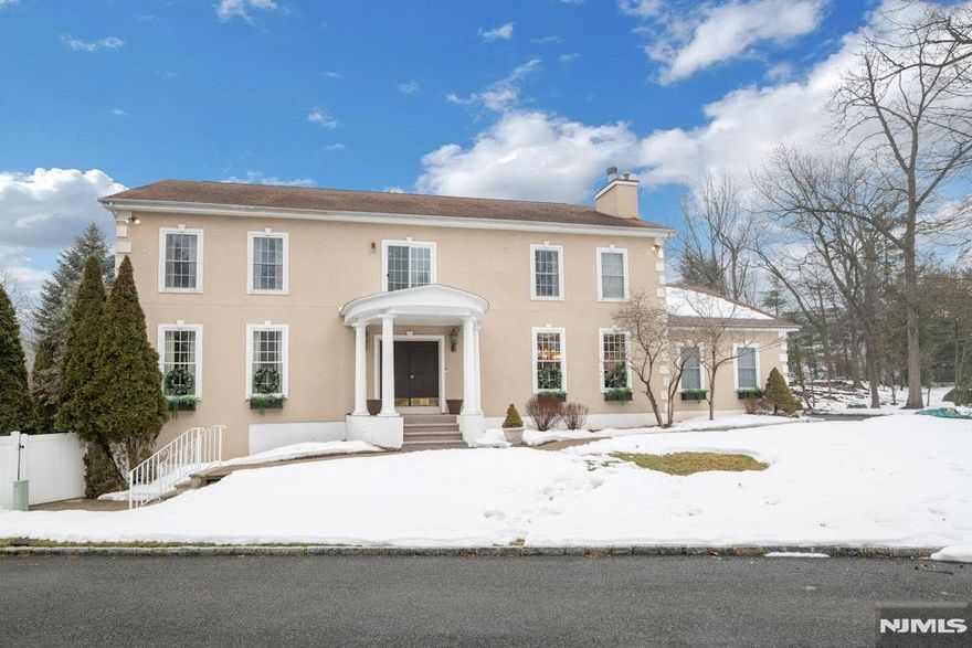 Experience ultimate luxury and convenience in this expansive, custom-built 6-bedroom, 5.5-bath Upper Montclair sanctuary, privately nestled on a tranquil cul-de-sac - just moments from the NYC direct train. Built in 1996, the main level welcomes you with a spacious living room with fireplace, an elegant dining room/family room combination ideal for gatherings, and a gourmet kitchen complemented by a separate scullery kitchen designed for seamless entertaining. A sun-drenched sunroom just off the kitchen provides the perfect setting for your morning coffee! Upstairs, you'll find 4 generously sized bedrooms, each with its own en suite bath, along with a bright, airy sitting area or home office at the top of the stairs. The lower level offers a legal, fully appointed ground-floor apartment featuring 2 bedrooms, 1 full bath, a living room, dining area, full kitchen, and it's own private entrance - ideal for guests or extended living comfort. In the warmer months, relax and entertain outdoors with an in-ground heated pool and inviting spaces for barbecuing and lounging. This rare property blends sophisticated comfort with unbeatable access to Montclair's vibrant dining, shopping, and cultural scene! This property is NOT a part of Reservoir Ridge. It is in Montclair and is a part of the Montclair School District.