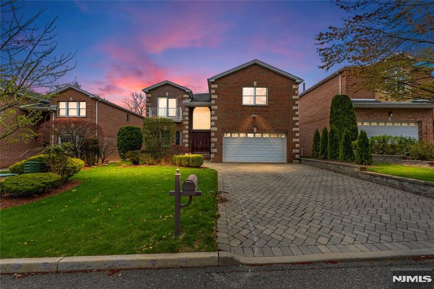 Located on a quiet, private street in Englewood Cliffs, this all-brick Colonial has been fully renovated from top to bottom. The main level showcases sleek, polished porcelain floors that set a luxurious tone throughout the home. A two-story foyer fills the space with natural light and leads to a library, formal dining room, and a spacious living area with a fireplace. The kitchen is designed for both style and practicality, with quartz countertops, a center island, high-end appliances, and opens to a private deck. Upstairs, the second level features rich hardwood floors throughout. The primary suite offers two walk-in closets and a spa-like bath with Jacuzzi and glass-enclosed shower. A guest suite with en-suite bath and balcony, two additional bedrooms with a Jack & Jill bath, and a cozy lounge. The walk-out basement is fully finished with high ceilings, offering a recreation room, playroom, guest bedroom, and full bath. Radiant heating adds comfort year-round, and the home is conveniently located minutes from the George Washington Bridge and major highways, with access to Englewood Cliffsâ€™ top-rated Kâ€“8 schools and low property taxes. OPEN HOUSE on Sunday, 5/4/2025 at 1-4 PM.