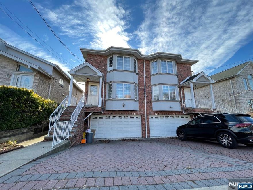 ALL BRICK DUPLEX TOWNHOUSE LOCATED THE MOST DESIRABLE AND CONVENIENT RESIDENTIAL AREA(BORDER OF RIDGEFIELD & PAL PARK). ALL HARDWOOD FLOOR THROUGH OUT, CHEF'S GOURMET OPEN KITCHEN WITH CUSTOM MADE CABINETS, GRANITE COUNTER TOP AND CUSTOM BATHS WITH CERAMIC TALES, FIRE PLACE IN THE LIVING ROOM, SLIDING DOOR TO THE DECK, MASTER BED ROOM HAS JACUZZI, FULL FINISHED BASEMENT WITH FBTH AND SEP. ENTRANCE. 2 CAR GARAGE. NO PETS.