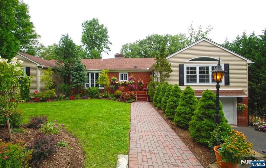 Short-term rental OK! Beautiful 5-bedroom, 3.5-bath home on 1 acre within walking distance to Franklin Lakes Nature Reserve. This unique two-floor layout offers two separate living areas, ideal for a mother/daughter or private guest suite, professional office, or in-home business. The lower-level entrance via a second driveway ensures each level has complete privacy. Zoned for business yet set in a quiet, park-like area, with private parking for eight cars. The main floor features a 600 sq. ft. master bedroom suite with two walk-in closets, luxurious bath with shower and jacuzzi, tray ceiling, and walkout deck. Three additional bedrooms share a full bath with jacuzzi tub as well as a powder room. A beautiful 350 sq. ft. eat-in kitchen with custom cabinets, granite countertops, and brand-new stainless-steel appliances opens to a formal living/dining room with a stone gas-fireplace and a large family room overlooking the fenced backyard. The lower level includes a private guest suite or office with kitchen, full bath, brick gas fireplace, and den/family room that walks out to the lovely backyard patio. The park-like backyard even features a gentle brook flowing through your nearly one-acre property. Central air, attached two-car garage. It's not a rental - it's a home!. Income and asset verification required. Tenant responsible for gas, electric, water, exterminating and snow removal and the first $175 of any repairs, full cost due to direct abuse. Pets OK.