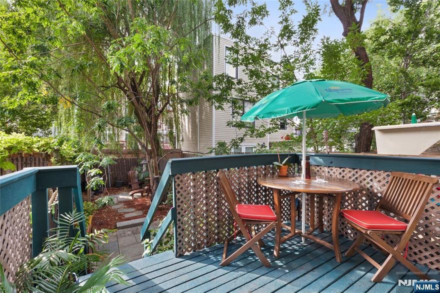 A rare find is this very special One Bedroom/One Bath offering a secluded private deck that descends to your very own private yard! This charming home is a rare Hoboken gem as it is a phenomenal way to get the kind of outdoor space youâ€™d only expect to get with a much larger condo or even a single family home. Private deck off of rear bedroom descends to patio and fence enclosed backyard haven. If you are a dog owner, barbeque specialist, or a serious garden or outdoor space lover you need not look any further! Part of the comfort and attributes that make this home appealing include stainless/granite kitchen with breakfast bar, attractive lighting, lovely and quiet comfortably sized bedroom overlooking your outdoor oasis. Also boasts hardwood floors throughout, charming exposed brick in living area and bedroom, new mini-split heat/cooling system, washer/dryer and storage in building. Among Hoboken's shops, eateries, parks, 1st Street pubs, nightlife, and nearby Sky Club gym. Easy commute- with buses to NYC, near 2nd St Light Rail, Blue Hop shuttle at your corner to PATH and NJ transit trains. A one bedroom home that has a lot going on at a superb downtown location near all Hoboken has to offer.